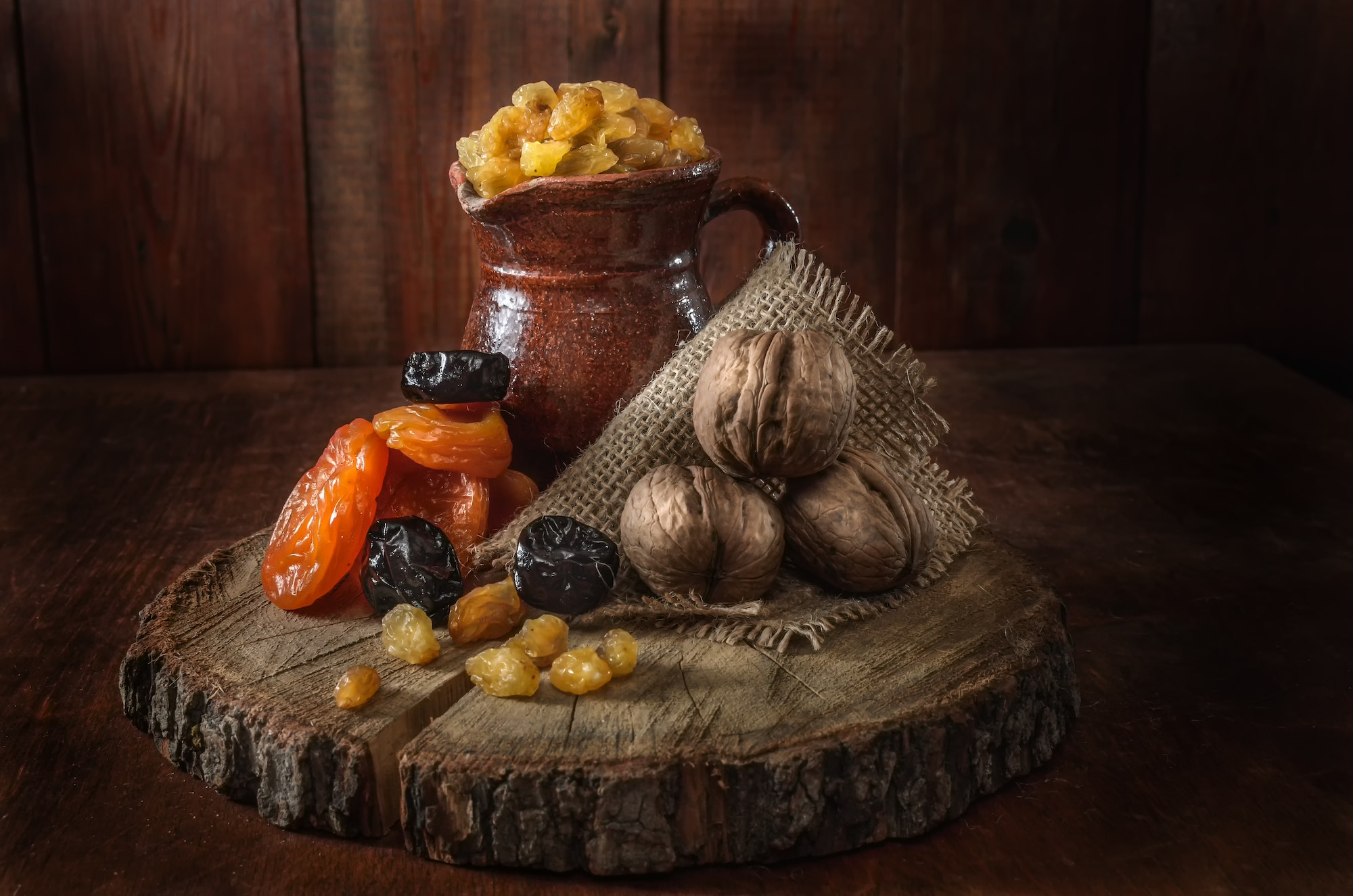 ceramic jug, dried apricots and other dried fruits