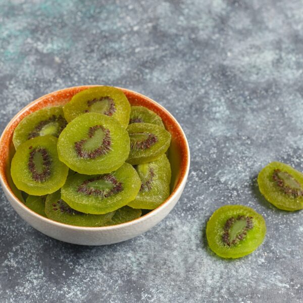 Dried homemade kiwi fruit with fresh kiwi.